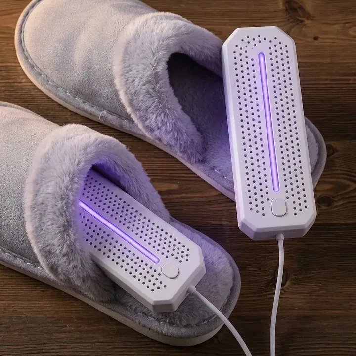 Shoe dryer insert inside a slipper, with the second insert beside it on a wooden table